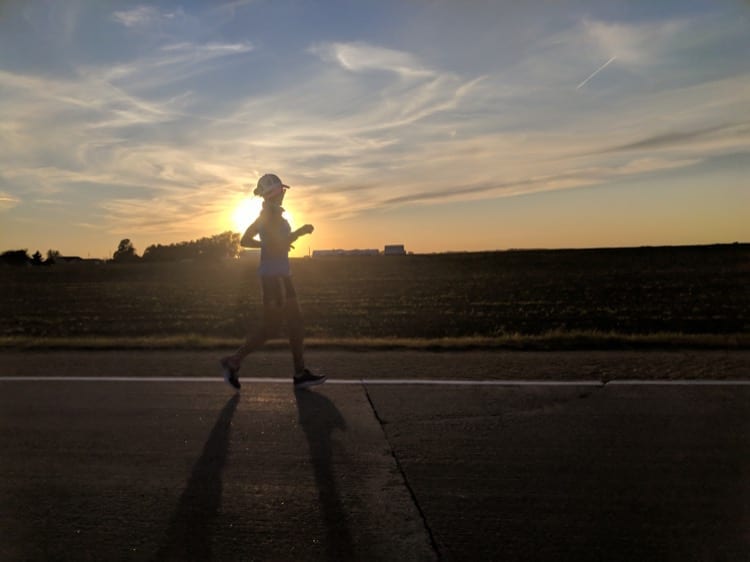   Day 38, Iowa. Cruising alone through the sunset after a pleasant day running with the Camachi Cross Country team. Photo: Jay Lee.  